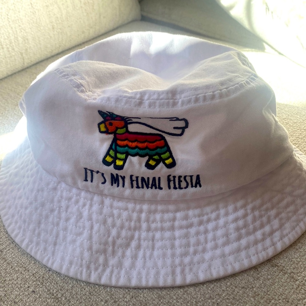 White bucket hat that says, “It’s My Final Fiesta” for a bride